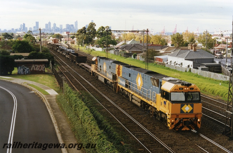 P18039
NR class 2, NR class 15, double heading NR 0940 interstate freight train, overhead electric wires, Footscray, Victoria
