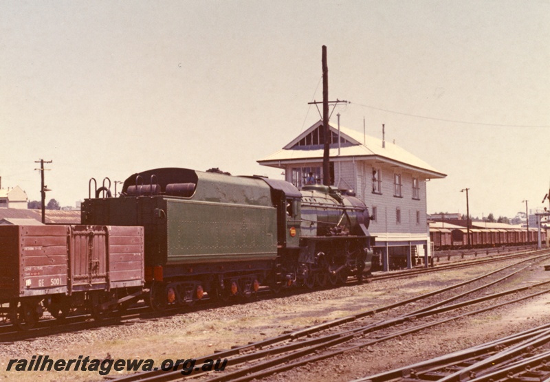 P18081
V class 1220, GE class wagon 5001 rear view of Perth Box A signal box, signal, rear and side view of loco, Perth Goods Yard, c1966
