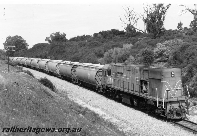 P18133
N class 1879 diesel locomotive hauling a rake of alumina hopper wagons enroute to Kwinana from Pinjarra.
