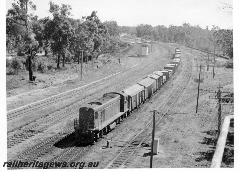 P18359
C class 1702, on up No 116 goods train, signal box, passing through Koojedda, ER line
