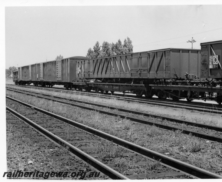 P18364
4 of 4 images of Commonwealth Railways (CR) wagons at Bassendean, including GL class 1851 on flat bed truck, side view
