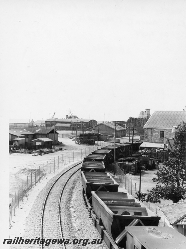 P18403
Empty bauxite train, standard gauge line on left, passing through fish market, Fremantle, FA line
