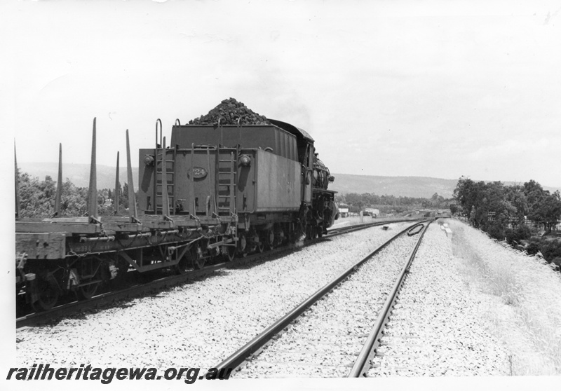 P18410
PMR class 724, on No 37 goods train, including QBB class bolster wagon, heading away from camera, Kenwick, SWR line, side and end view
