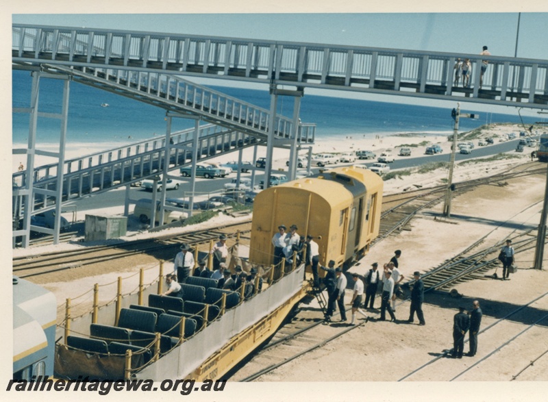 P18413
Standard gauge inspection train, including yellow van and WF class 3003 flat wagon with seats installed, passengers boarding by ladder, overhead footbridge, signal, beach, Leighton yard
