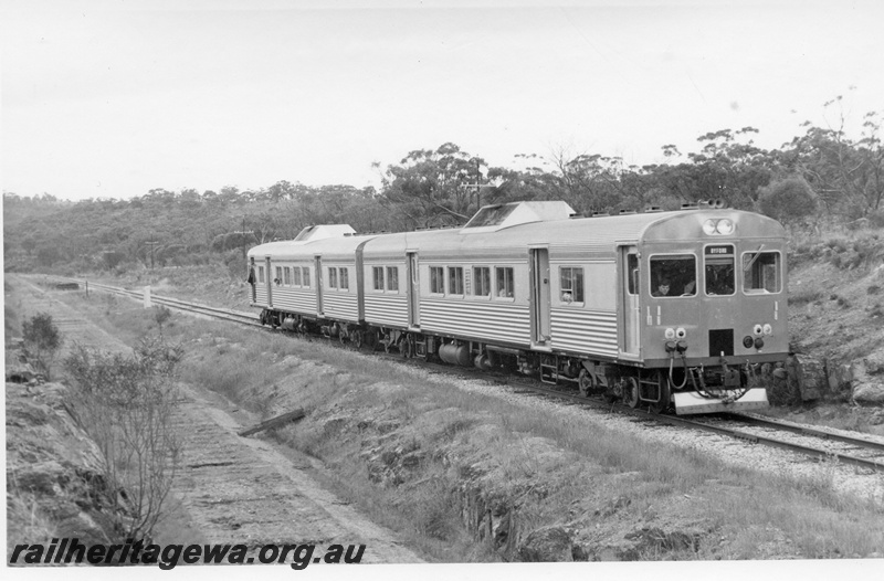 P18467
Two ADK class railcars, on ARHS tour to Wundowie, platform at Mokine in the background, the difference in the level of the abandoned trackbed and the line still in use is noticeable, ER line
