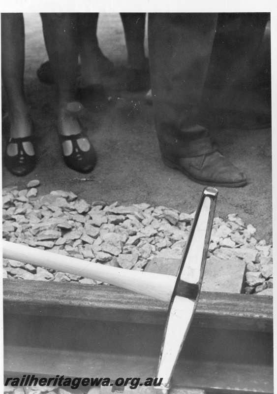 P18474
5 of 12 images relating to the ceremony for the linking of the standard gauge railways at Kalgoorlie, nickel plated hammer and golden spike used to complete the linking of the standard gauge railways
