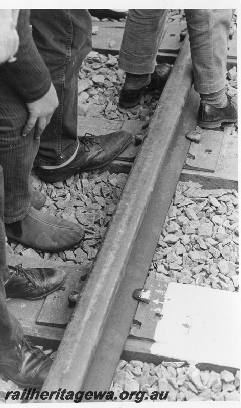 P18475
6 of 12 images relating to the ceremony for the linking of the standard gauge railways at Kalgoorlie, golden spike having been driven into the track
