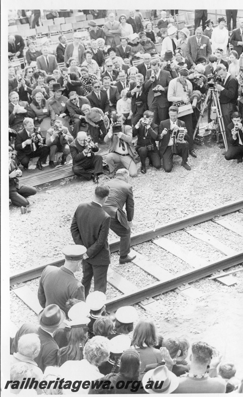 P18478
9 of 12 images relating to the ceremony for the linking of the standard gauge railways at Kalgoorlie, WA Premier Brand drives home the second last gold dog spike to link the standard gauge railways
