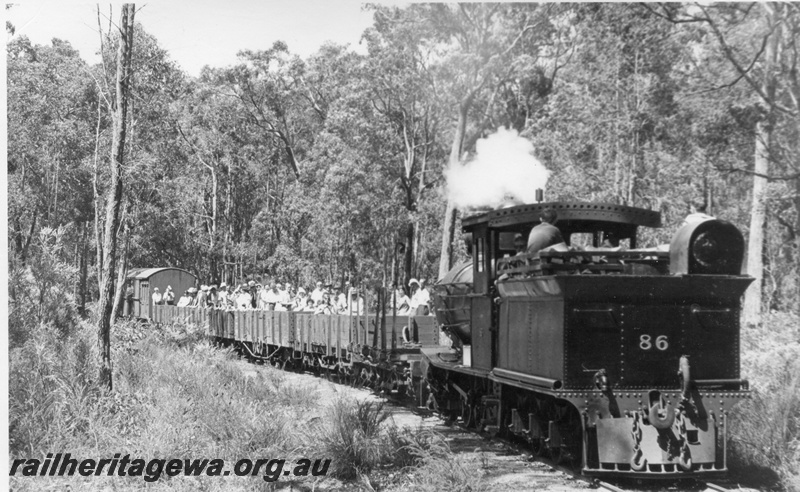 P18492
YX class 86, tender first, on tour train, Donnelly River Mill, side and rear view 
