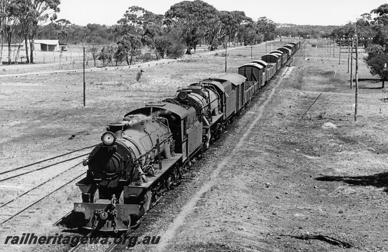 P18538
W class 959, V class 1220, on No 12 goods train, lines of electric and telegraph wire poles, level crossing, Yornaning, GSR line, front and side view from elevated position
