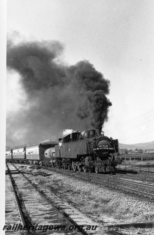 P18590
3 of 7 images of DM class 586 on ARHS tour train to Gingin on MR line, Millendon Junction, blowing black smoke from Newcastle coal
