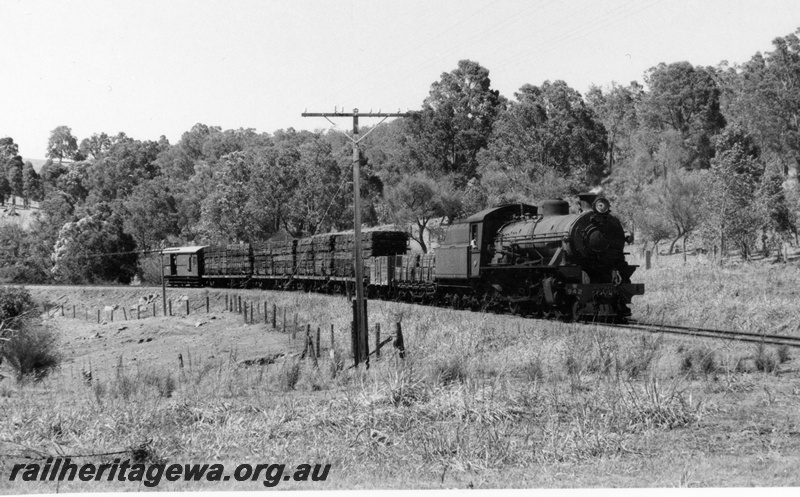 P18603
W class 942, on Pinjarra to Dwellingup goods train comprising wagons loaded with timber and van, PN line
