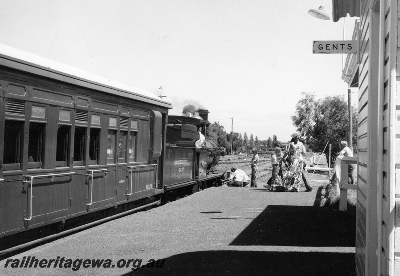 P18622
G class 233 steam locomotive 'Leschenaultia Lady' at Busselton. Former suburban carriage AU 218 behind the locomotive.
