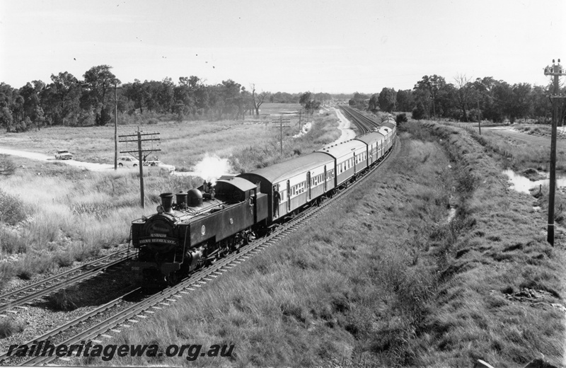 P18628
DD class 592 steam locomotive at the head of a Fremantle bound 'City Circle' train at Kalamunda Road overbridge. 
