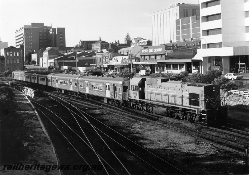 P18629
AB class 1533 diesel locomotive arriving Perth Station on a suburban service comprising leased Queensland suburban carriages. SWR line.
