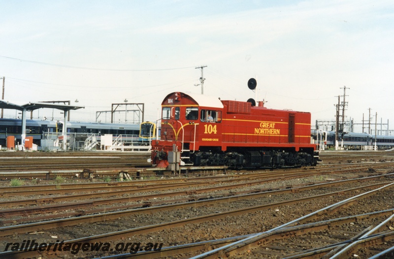 P18643
2 of 6 views of J class 104 diesel locomotive at Spencer Street yard in Melbourne. In the background are views of Victorian Railways Sprinter type railcars.
