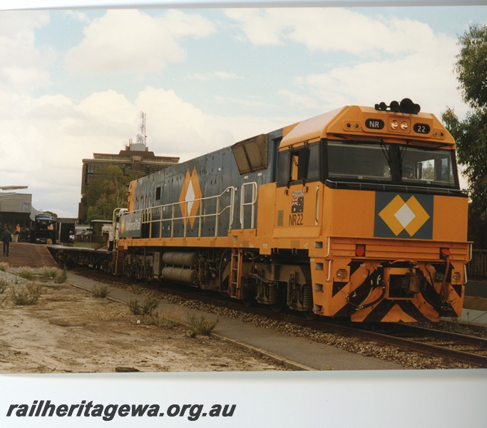 P18661
NR class 22 standard gauge diesel locomotive 'Kalgoorlie' pictured at East Perth Terminal about to shunt motorial wagons to the Indian Pacific passenger train. Locomotive painted in standard National Rail colours of charcoal grey and orange.
