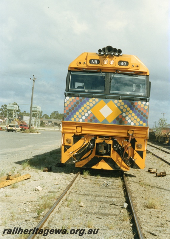 P18671
NR class 30 standard gauge diesel locomotive, painted in an indigenous colour scheme, is pictured at Kewdale awaiting its next duty.
