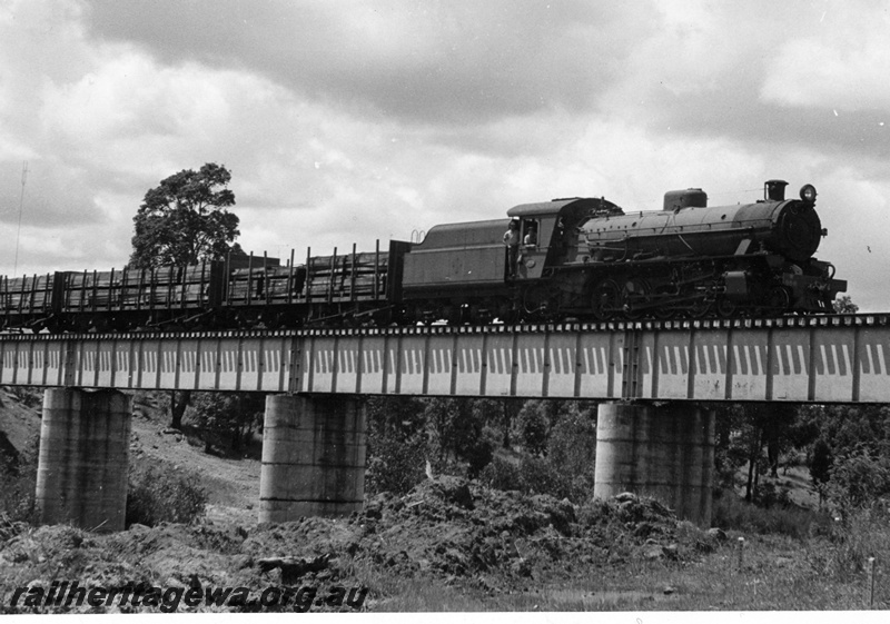 P18716
W class 958, on timber train, crossing concrete and steel bridge, side and front view
