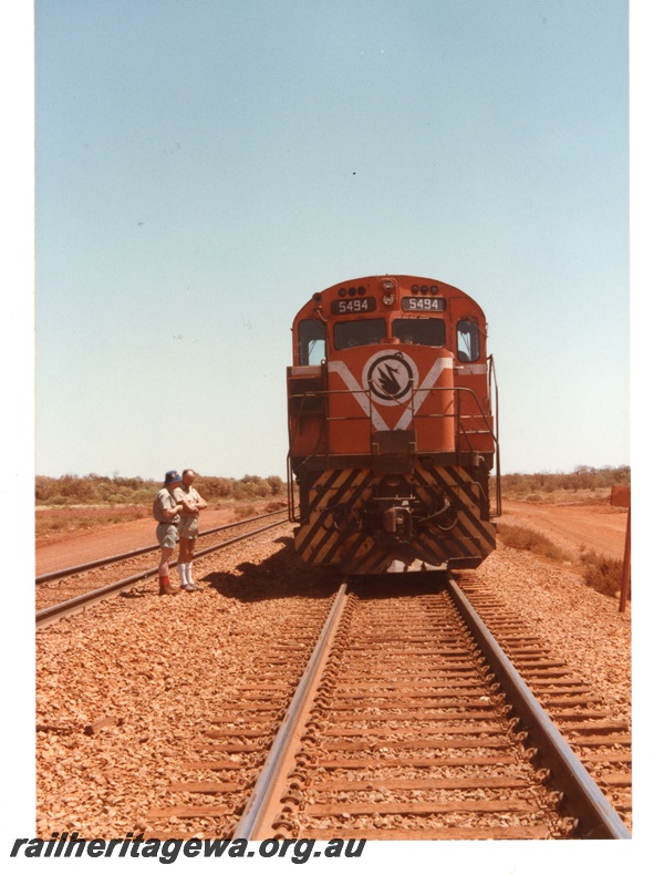 P18731
Mount Newman (MNM) M636 class 5494 waits for a cross at Poonda siding. 
