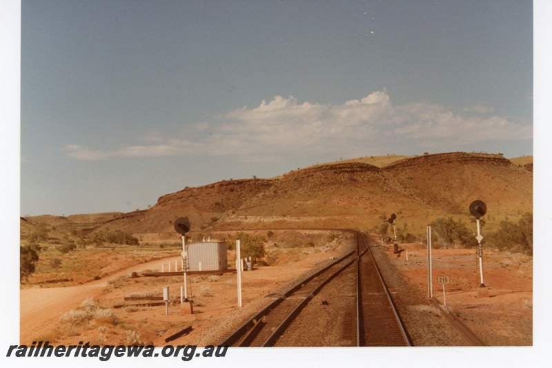 P18749
Mount Newman (MNM) driver view of empty train departing Garden siding. 
