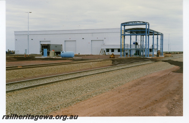 P18878
BHP Iron Ore (BHPIO) Goldsworthy J/V Boodarie locomotive and ore car service facility Finucane Island. New ore car number 336 on middle road.
