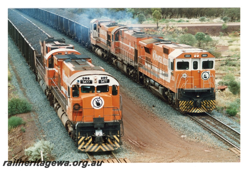 P18888
Mount Newman (MNM) at Newman mine loadout M636 class 5477 & C636 class 5467, CM39-8 class 5631, M636 class 5494, CM36-7 M class wait for departure to Port Hedland.
