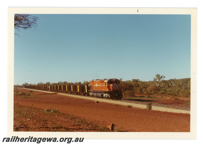 P18930
Mount Newman (MNM) C636 class 5463 empty iron ore train approaching Newman. 
