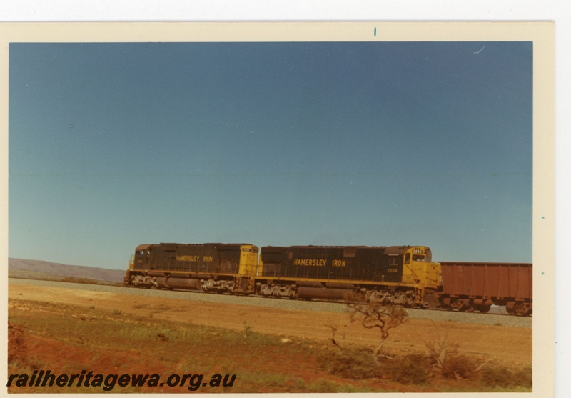 P18934
Hamersley Iron (HI) C636 class 2009 C628 class 2004 haul empty iron ore train near Ibis. Rear view of locos.
