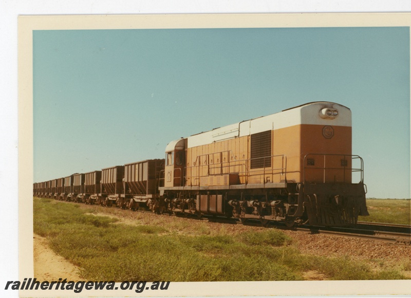 P18935
Goldsworthy Mining (GML) A class 6 approaches Finucane Island with a loaded iron ore train.
