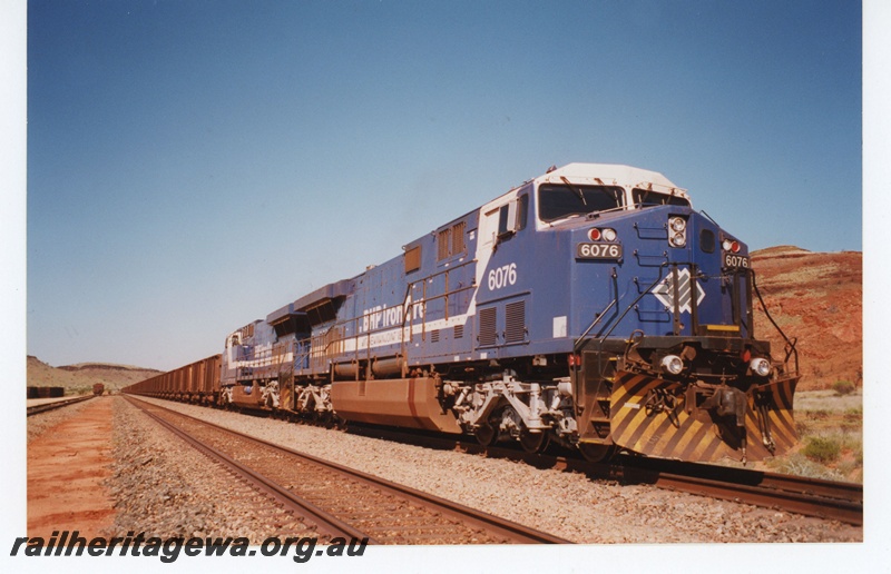 P19004
BHP Iron Ore (BHPIO) AC6000W class 6076 at Garden Siding. 
