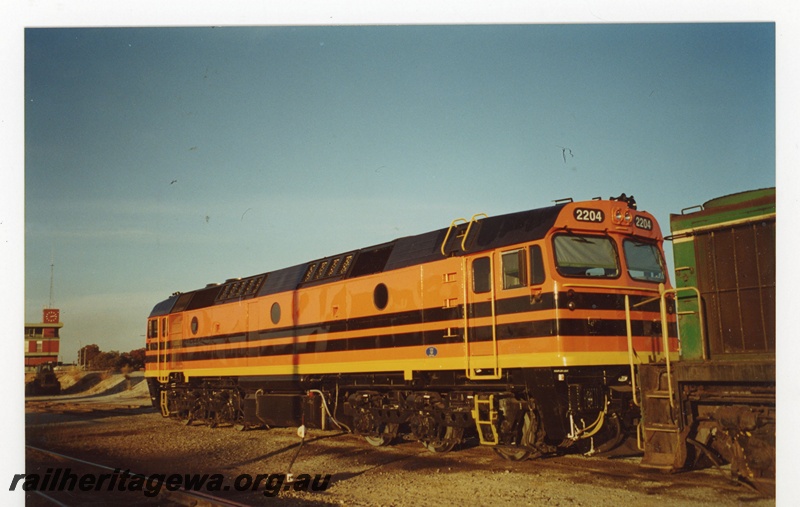 P19064
Australian Western Railway (AWR) 22 class 2204 at Forrestfield. Locomotive painted in AWR orange livery with 2 black stripes. 
