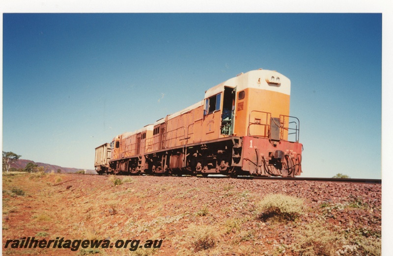 P19084
Goldsworthy Mining (GML) B class 1 and 2 haul a single ore car near Shay Gap.
