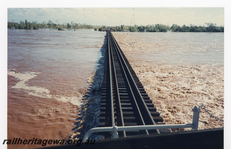 P19126
BHP Iron Ore (BHPIO) Goldsworthy Operations De Grey River in flood following Cyclone Kirstie. Photo taken from cab of locomotive. 
