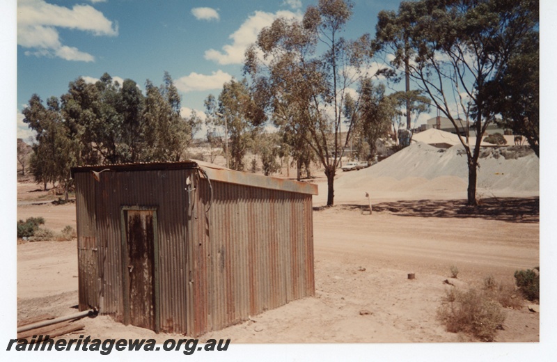 P19283
Iron shed, gravel piles, industrial building, ground level view
