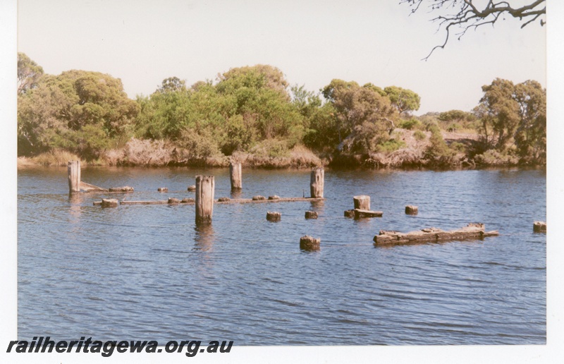 P19302
Remains of the Hay River bridge, view across the river showing only stumps, D line
