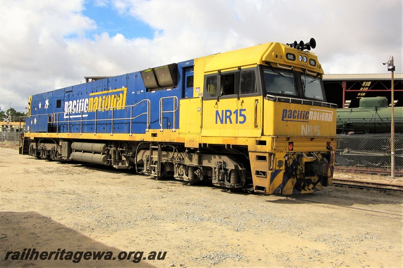 P19309
Pacific National NR class 15, yellow and blue livery, on the site of the Railway Transport Museum, side and front view
