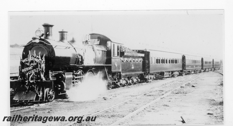 P19337
E class 352, decorated, hauling the Royal Train for the Duke of York, view along the train, front and side view.
