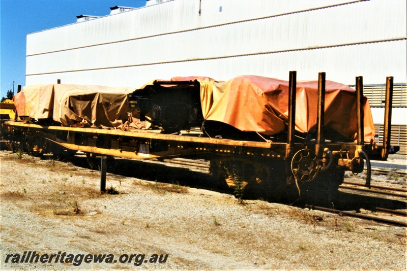 P19404
QUA class 23103 with end stanchions, yellow livery, Forrestfield Yard, tarpaulin covered load, side and end view
