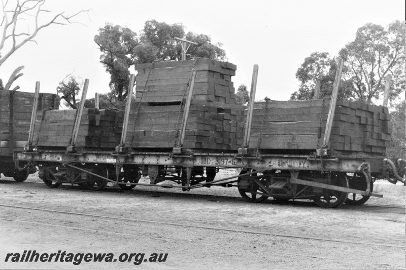 P19440
QBC class 3197 flat wagon with stanchions, yellow livery, Armadale, SWR line, load of sleepers, side and end view
