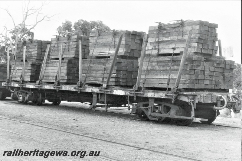 P19441
QBE class 2352_  bogie flat wagon with stanchions, brown livery, load of sleepers, Armadale, SWR line, side and end view
