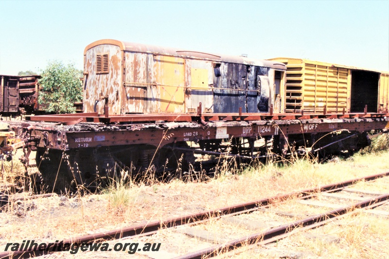 P19450
QRP class 11244 flat wagon, brown livery, Midland Workshops, end and side view
