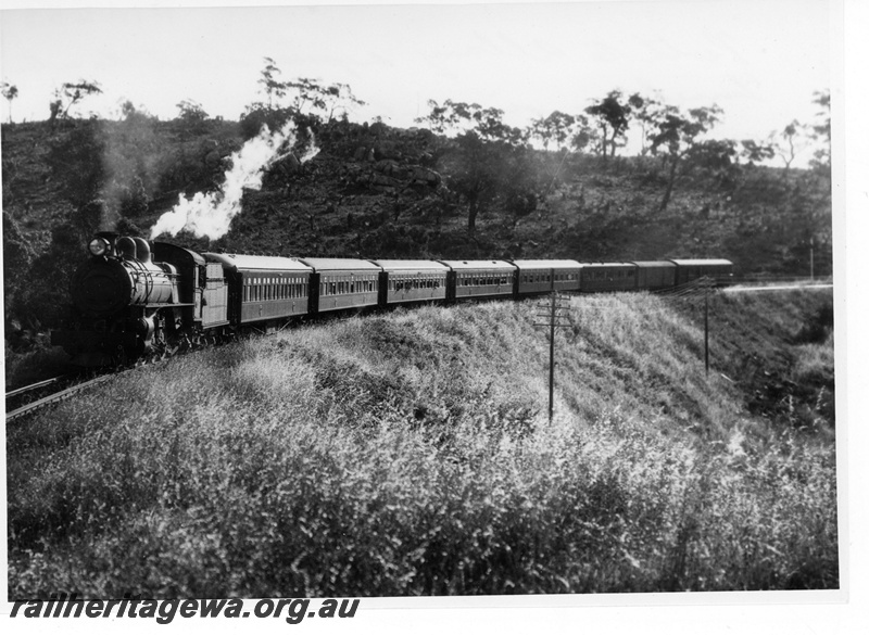 P19455
P class loco on Perth to Albany express, about to enter Swan View tunnel, ER line, front and side view, c1931
