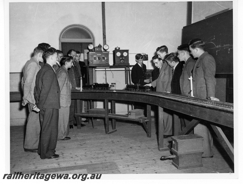 P19458
Class of safe working students, model railway, blackboard, block instruments, staff box, interior view
