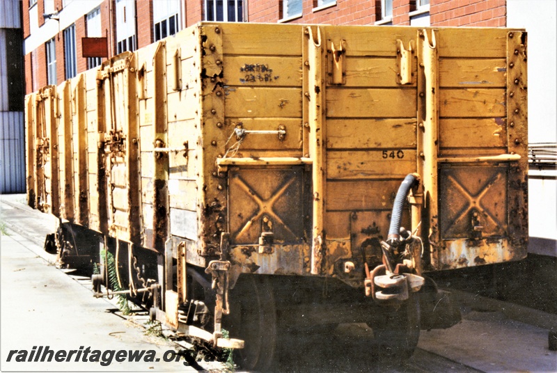 P19547
RCA class 24018 bogie open wagon, yellow livery with a small Westrail logo on the right hand end of the side, Forrestfield, mainly an end view
