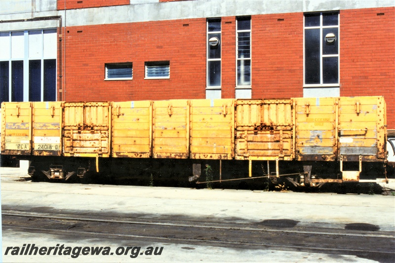 P19548
RCA class 24018 bogie open wagon, yellow livery with a small Westrail logo on the right hand end of the side, Forrestfield, mainly a side view
