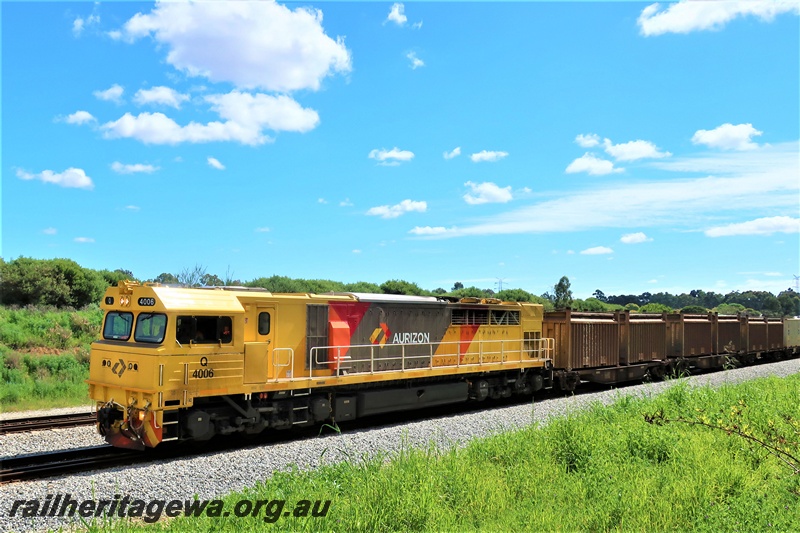 P19553
Aurizon Q class 4006 in the yellow grey and red livery on a freight train heading south through Hazelmere
