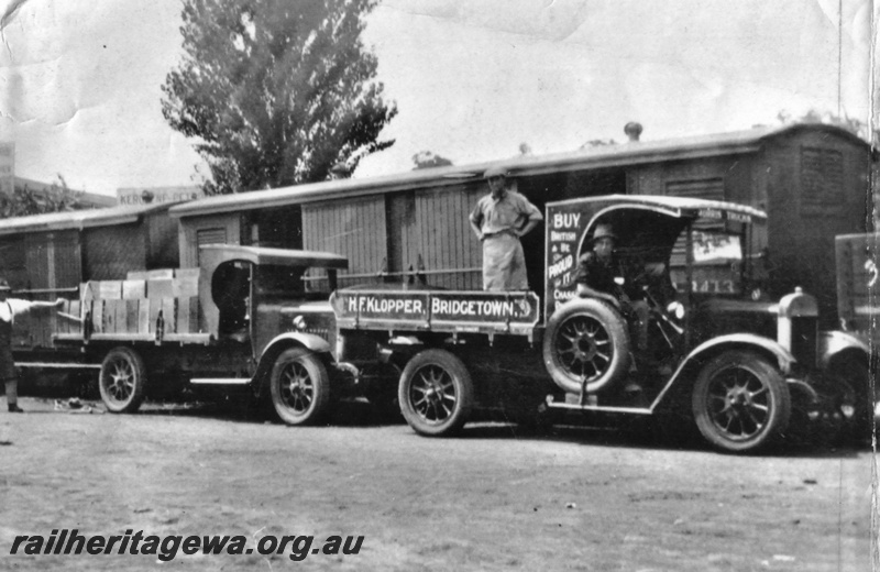 P19603
Bridgetown station yard - loading fruit from H. F. Klopper truck into railway wagon. PP line 
