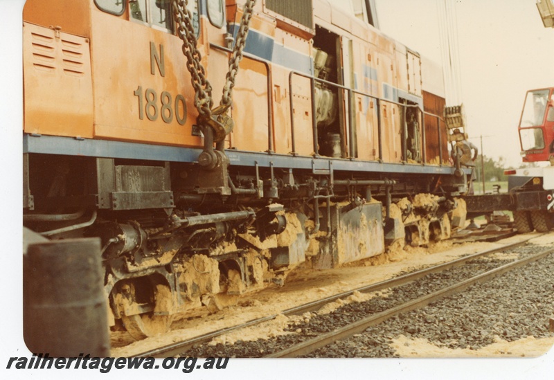 P19623
N class 1880 being lifted by 3 cranes following a level crossing accident with a truck at Wagerup. Close up of lifting anchor points on locomotive. SWR line.
