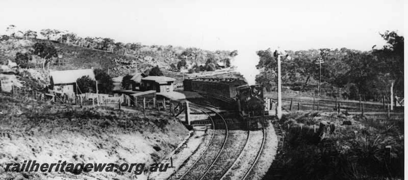 P19644
G class loco hauling a passenger train consisting of AP class carriages, station building, signal, sidings in the background, Swan View, ER line, train heading east.
